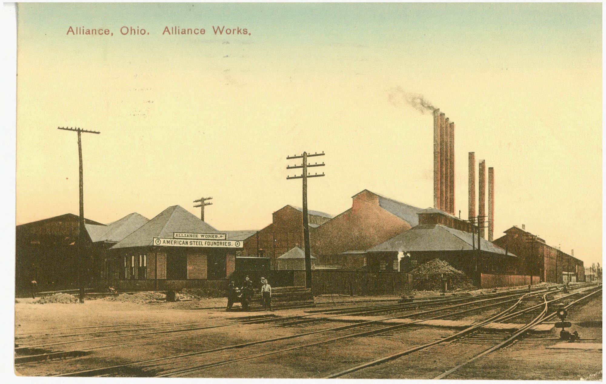 The American Steel Foundries plant showing railroad tracks and smoke stacks.