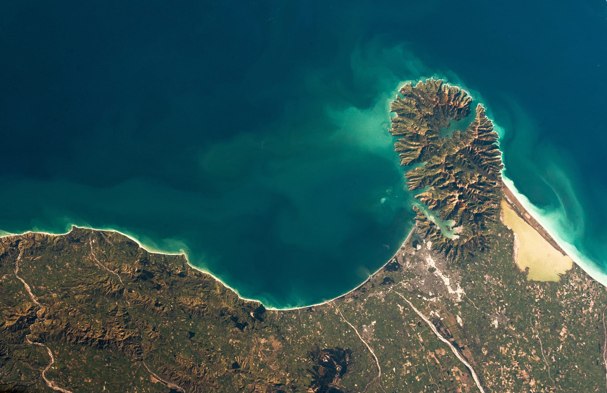 Ocean currents around Banks Peninsula in New Zealand. Sometimes the water changes colour several times per day.
ID: 2018 401U7497
Credit: ESA/A.Gerst