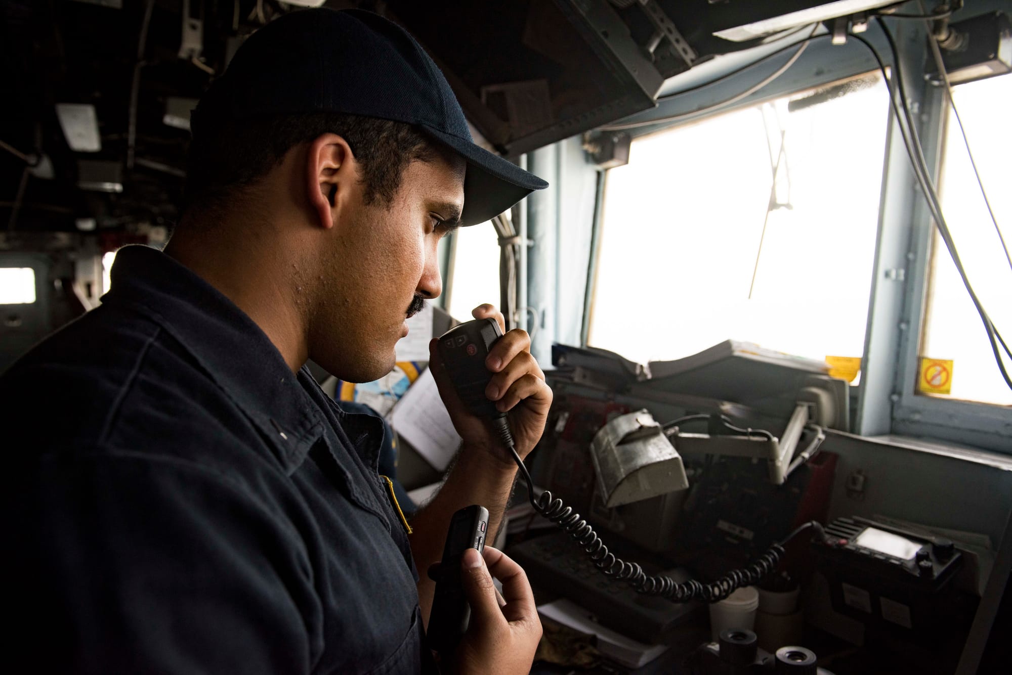 STRAIT OF HORMUZ (July 21, 2016) Lt j.g. Jonathan Bermudez, assigned to the guided-missile cruiser USS San Jacinto (CG 56), communicates with an Iranian warship during a transit of the Strait of Hormuz. San Jacinto, part of the Eisenhower Carrier Strike Group, is deployed in support of maritime security operations and theater security cooperation efforts in the U.S. 5th Fleet are of operations. (U.S. Navy photo by Mass Communication Specialist 3rd Class J. Alexander Delgado/Released) 160721-N-OR652-571
Join the conversation:
www.navy.mil/viewGallery.asp
www.facebook.com/USNavy
www.twitter.com/USNavy
navylive.dodlive.mil
pinterest.com
plus.google.com