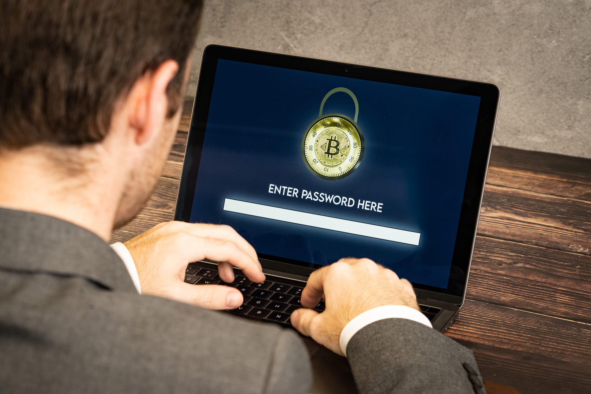 Concept image showing a person entering their crypto wallet password on a laptop. This is an image created to represent the concept of crypto wallet security and has been tagged for reuse under the Creative Commons Attribution licence. If you use it, please provide a link to https://www.bybit.com/en-US/ as credit for the image.
