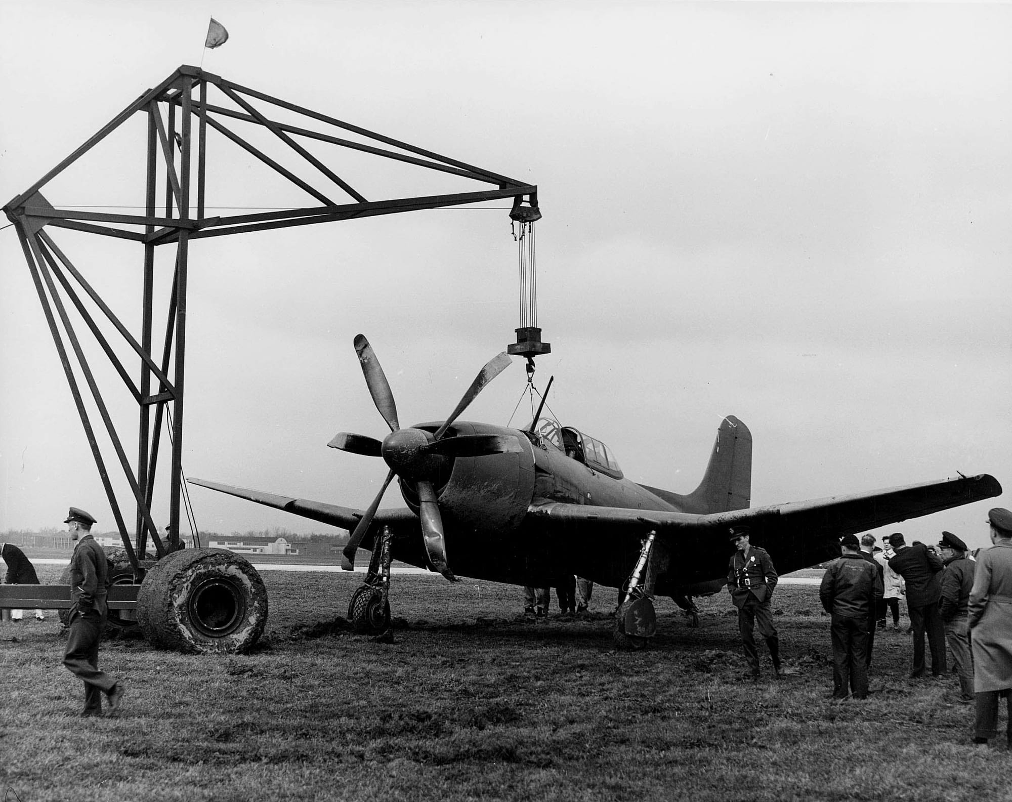 A damaged U.S. Navy Curtiss XBTC-2 being lifted by a crane following a landing accident. Among the aircraft procured by the Navy for evaluation as a bombing-torpedo aircraft, the XBTC-2 was a single-seater that featured a 3,000 hp Pratt & Whitney XR-4360-8A equipped with unique contrarotating propellers. Curtiss-Wright received the contract for the aircraft on 31 December 1943, but the XBTC-2 did not take to the air for its maiden flight until July 1946. This was well after the first flights of the Douglas XBT2D-1 Skyraider and Martin XBTM-1 Mauler that were ultimately chosen to compete for the contract.
