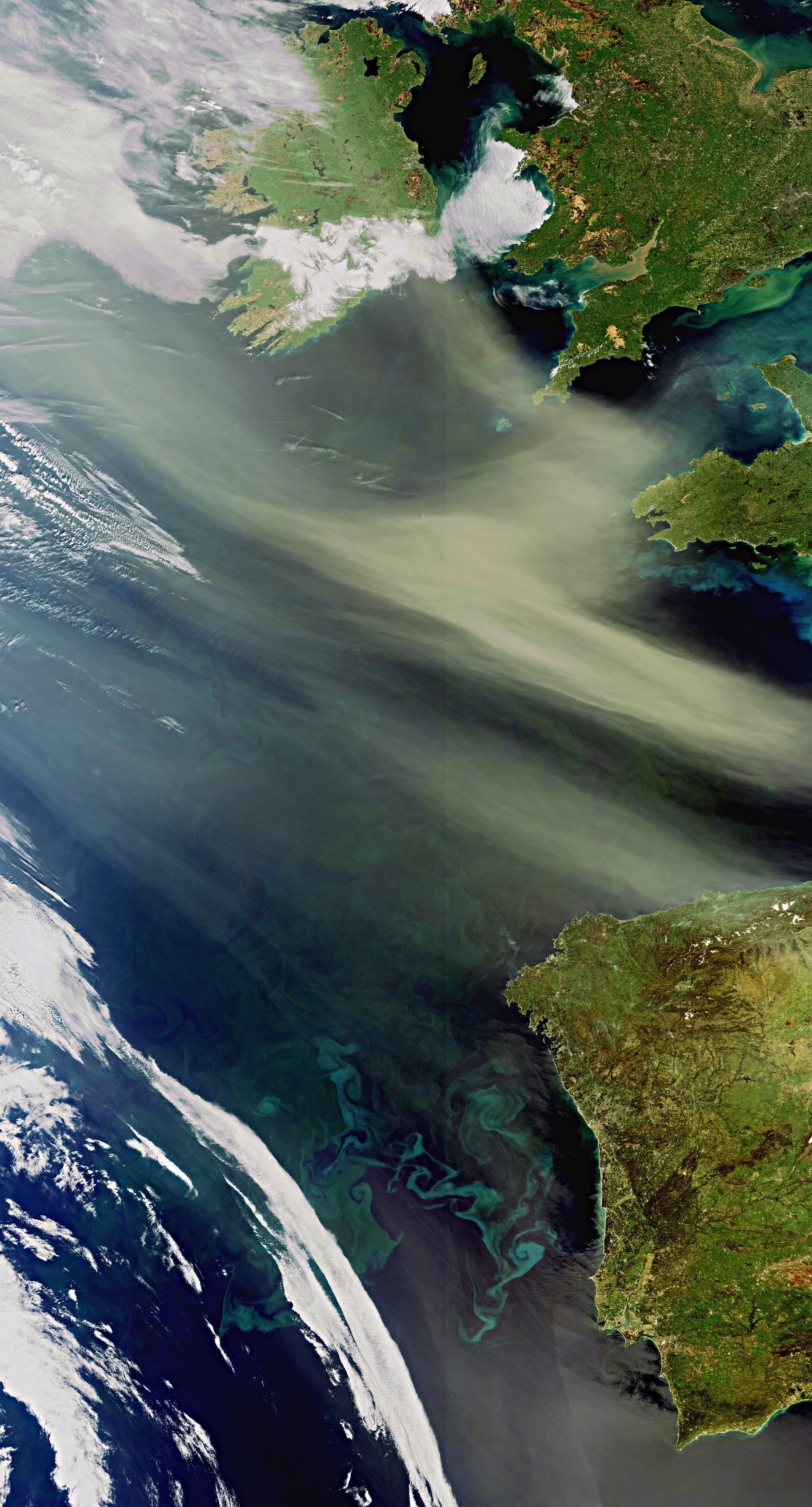 Envisat captures dust and sand from the Algerian Sahara Desert, located in northern Africa, blowing west across the Atlantic Ocean. Sandstorms are very common over the Sahara, and large concentrations of the dust can be found in the tropical Atlantic and the Caribbean. The dust contains many nutrients, including nitrogen, phosphorus and iron, which act as a fertiliser and stimulate the production of massive plankton blooms. In this image, plankton blooms are visible in the Atlantic as blue and green swirls.
Although some types of plankton are individually microscopic, the chlorophyll they use for photosynthesis collectively tints the colour of the surrounding ocean waters. This allows dedicated 'ocean colour' satellite sensors, such as Envisat's Medium Resolution Imaging Spectrometer (MERIS), to detect them from space. MERIS acquired this image on 8 April 2011 at a resolution of 300 m.