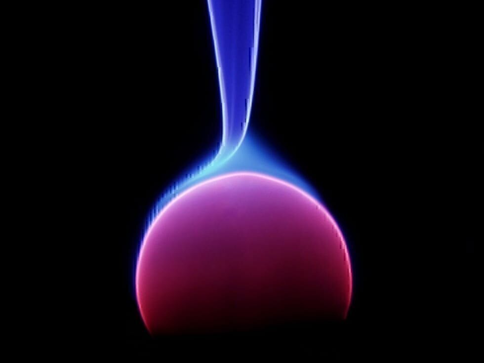 Energy arc off of the central electrode in a plasma lamp.