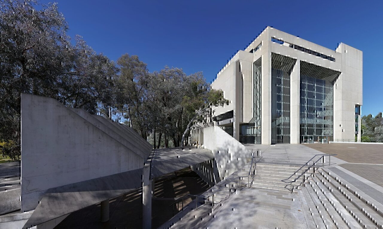 The High Court of Australia, in Canberra ACT, is an unusual and distinctive structure, built in the brutalist style, and features a public atrium with a 24-metre-high roof. The building was completed in 1980. The High Court was added to the Australian National Heritage List in November 2007. This image was stitched from a series of six 24mm images, taken without the use of a pano-head.