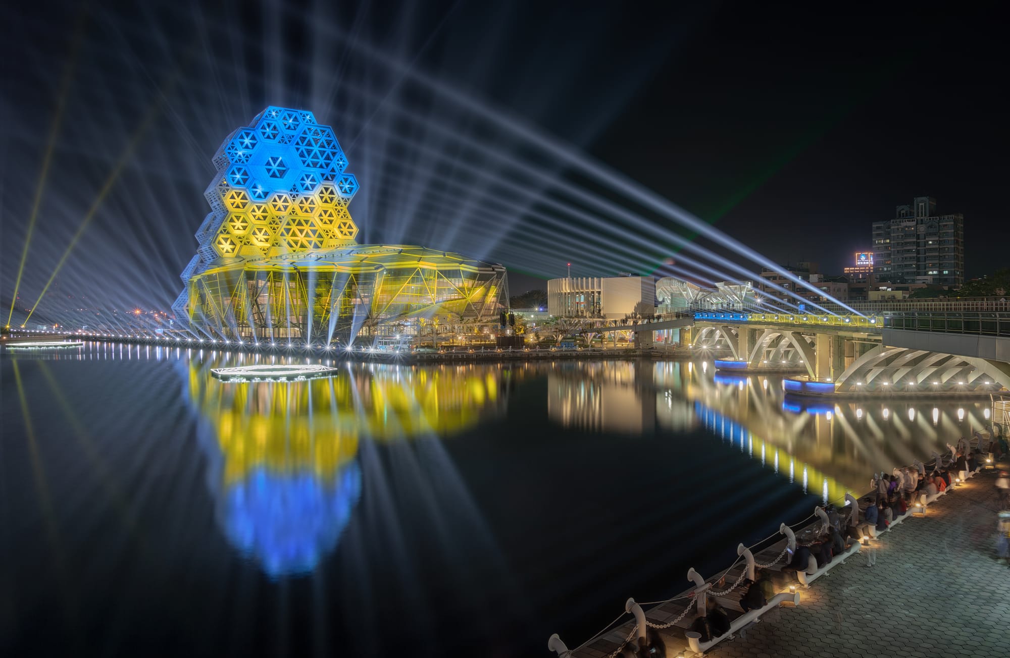 The Kaohsiung Music Center and the Lingyaliao Railroad Bridge illuminated in the colors of Ukraine's national flag during the 2022 Taiwan Lantern Festival. This light show was displayed from February 26, two days after Russia's invasion of Ukraine, to February 28, when the annual Lantern Festival ended.
This image is a blend of different exposure times: 59.0", 30.0", 9.0", 4.0", 2.0", and 1.0".