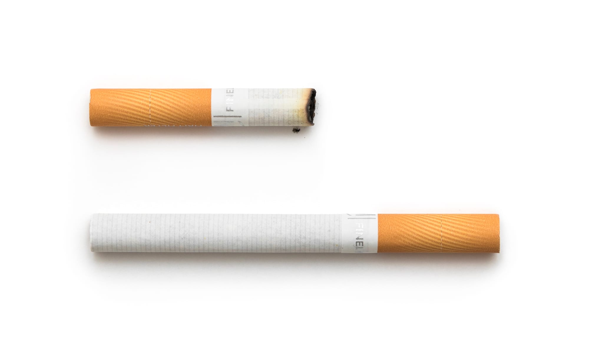 Pair of L&M Finely Cut cigarettes, sold in Poland. The first cigarette from the top has been smoked.