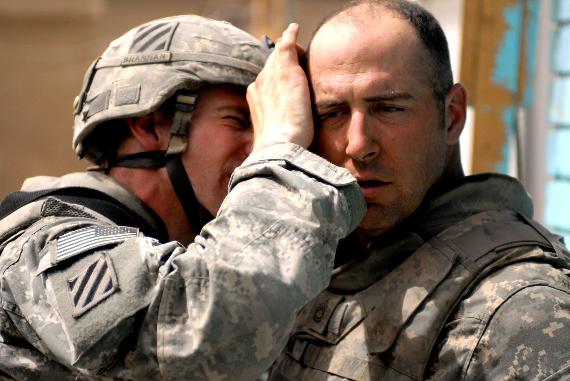Sgt. Paul Brennan, a Wellingborough, England, native, checks the ears of Sgt. 1st Class Ronald Sloan, a Lecanto, Fla., native, after an explosion at Joint Security Station Sadr City in the Thawra 1 neighborhood of Baghdad April 28. Sloan is a tank commander with Company D, 4th Battalion, 64th Armor Regiment, 4th Brigade Combat Team, 3rd Infantry Division, which is currently attached to 3rd Brigade Combat Team, 4th Infantry Division, Multi-National Division - Baghdad. Brennan serves as a medic with Co. D, 4th Bn., 64th AR. (U.S. Army photo/Sgt. Zach Mott)
