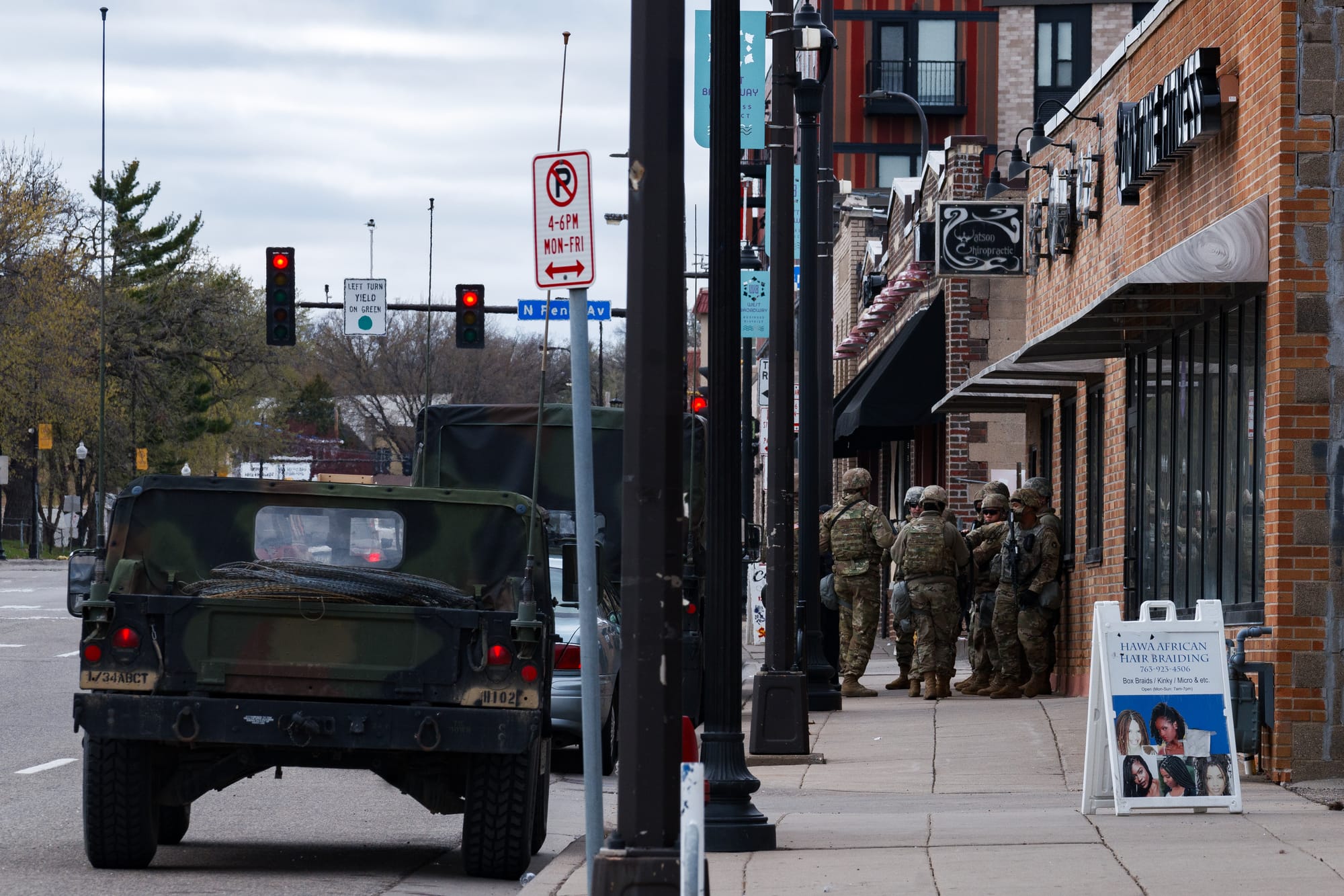 The National Guard standing on the streets of North Minneapolis after Brooklyn Center Police Officer Kim Potter shot and killed 20 year old Daunte Wright.
--
This image is part of a continuing series following the unrest and events in Minneapolis following the May 25th, 2020 murder of George Floyd. 

Chad Davis Photography: Minneapolis Uprising