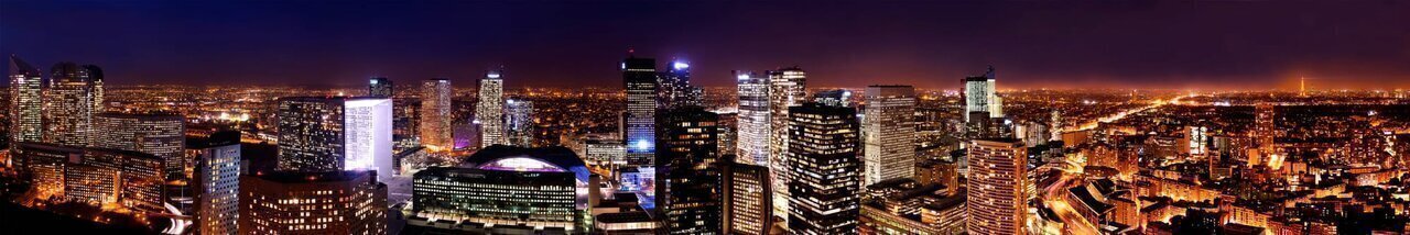 Paris business district of La Défense (cities of Puteaux, Courbevoie and Nanterre) as seen from the tour Défense 2000. The historical axis joins the Arc de Triomphe du Carrousel to the Grande Arche de la Fraternité passing by the Arc de Triomphe de l'Étoile.