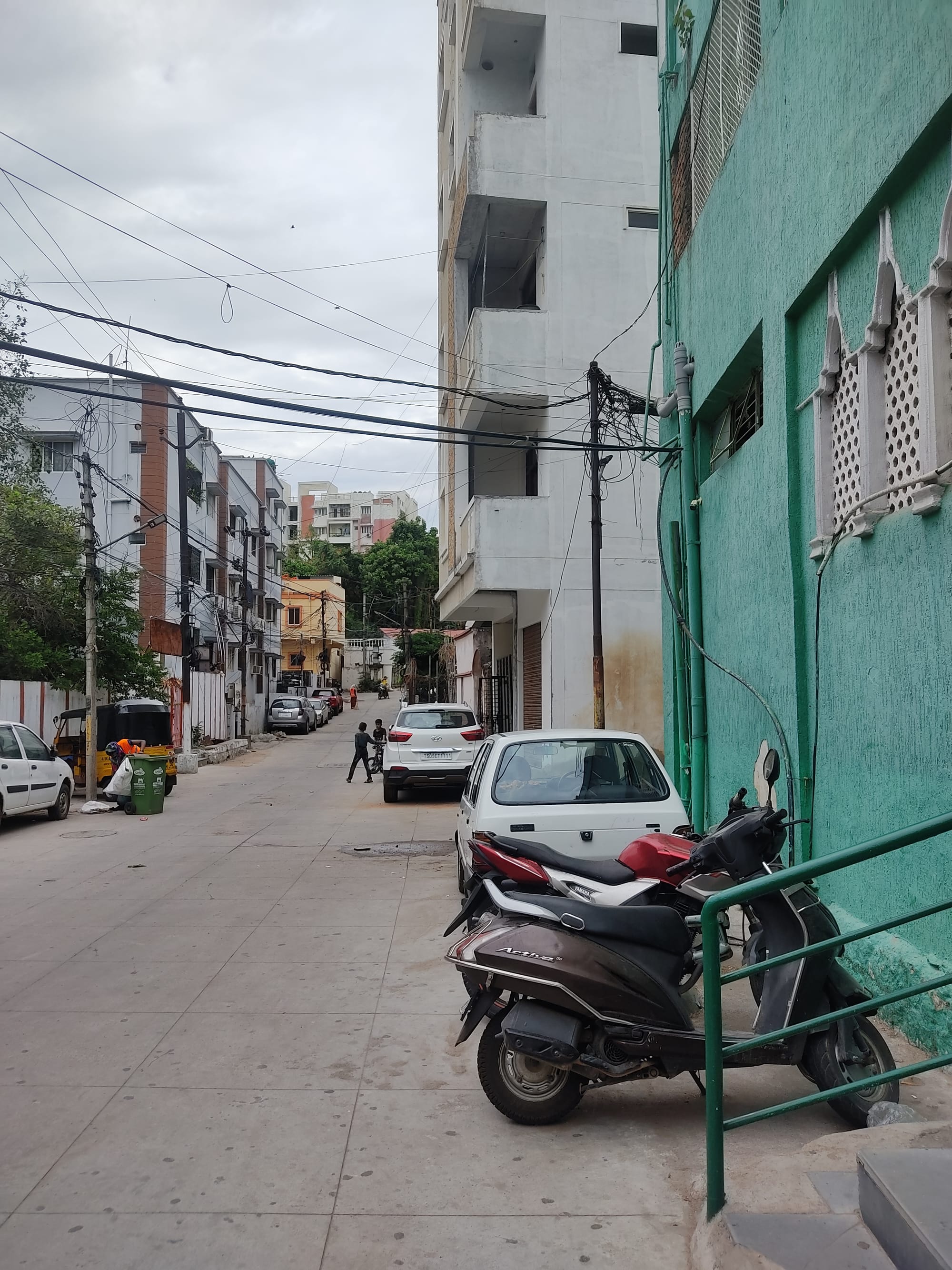 Cars and bikes parked in a street