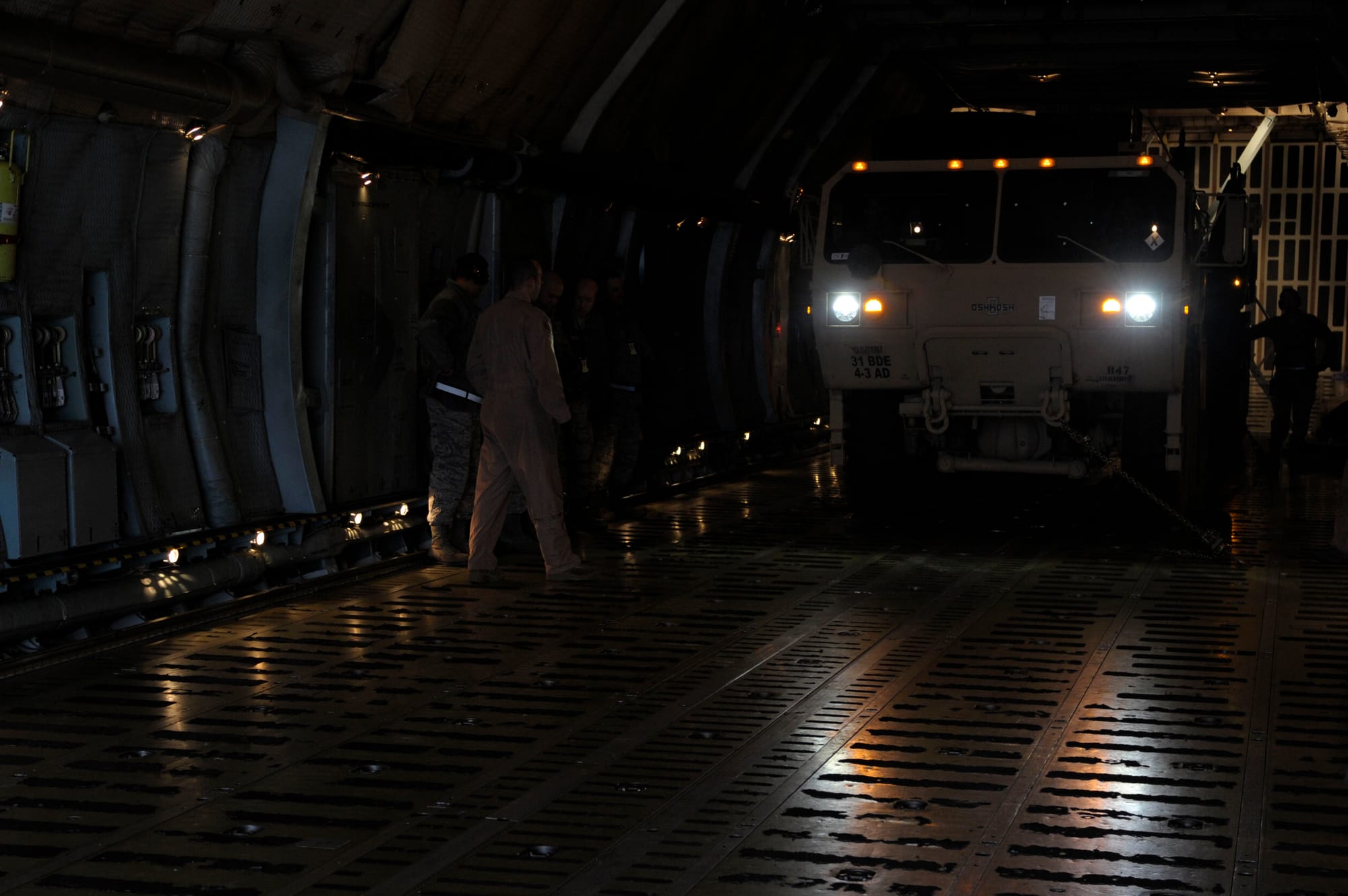 Crews drive an M983A2 Heavy Expanded Mobility Tactical Truck pulling a mobile Patriot missile launcher belonging to Fort Sill, Oklahoma's 3rd Battalion, 2nd Air Defense Artillery off a West Virginia Air National Guard C-5 Galaxy aircraft taking part in the deployment of U.S. and NATO Patriot missile batteries and personnel at Incirlik Air Base, Turkey, Jan. 5. Elements of the 3-2nd, U.S. Army Europe's 10th Army Air and Missile Defense Command and 44th Expeditionary Signal Battalion, and other U.S. and NATO units deployed in support of NATO’s commitment to defending Turkey’s security during a period of regional instability. (Photo by Staff Sgt. Daniel Owen)