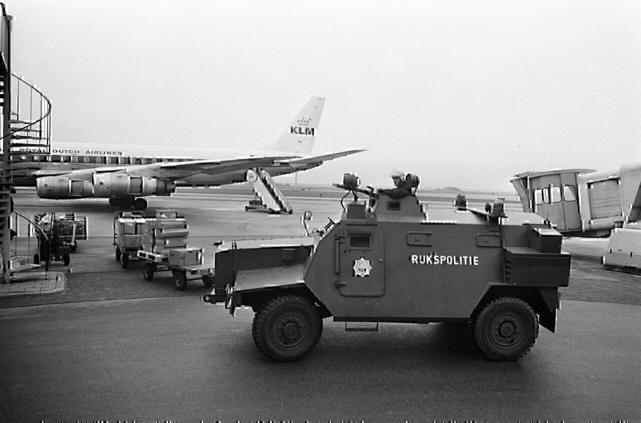 Sankey armored vehicle of the State Police (Rijkspolitie) of the Netherlands. The photo shows Schiphol Airport Amsterdam, during security measures in 1974, fearing Palastinian terrorist attacks. In the background a passanger airplane of KLM Royal Dutch Airlines.