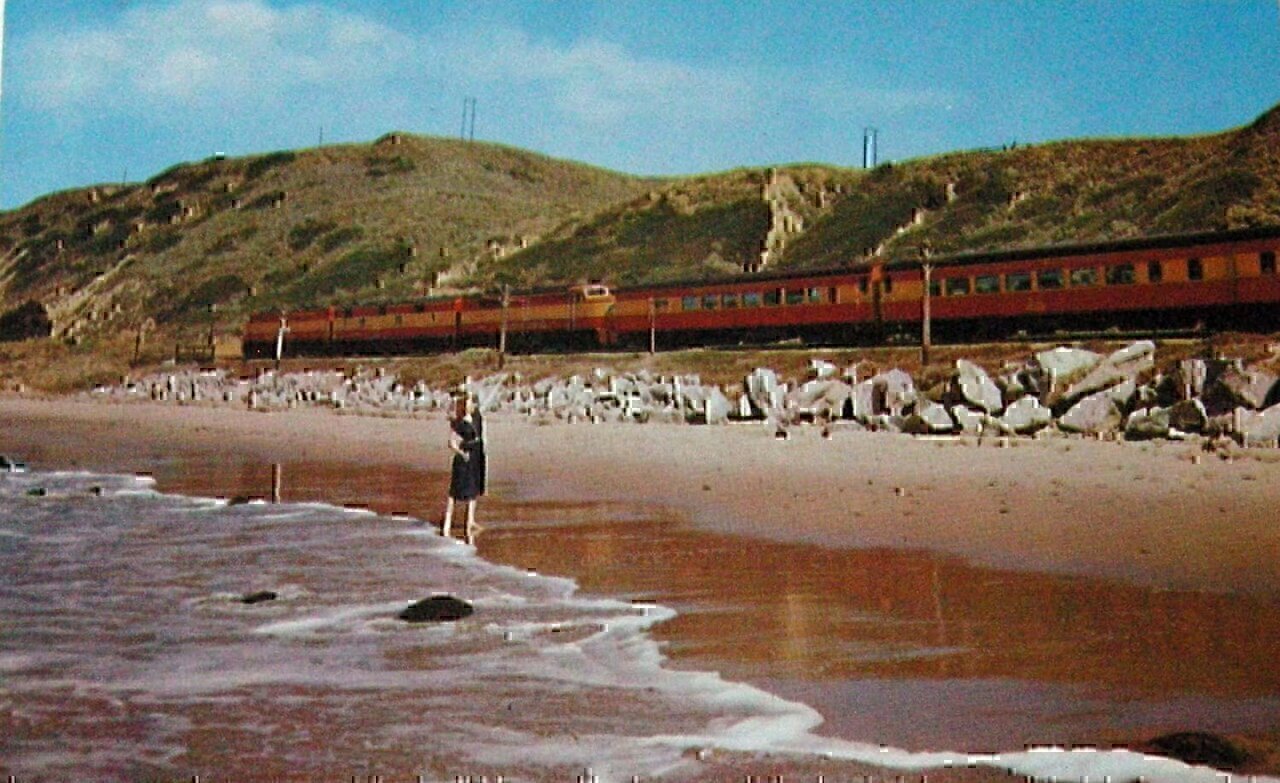 Postcard photo of the Southern Pacific Coast Daylight on its way between San Francisco and Los Angeles.  The train is powered by diesel locomotives in this photo.