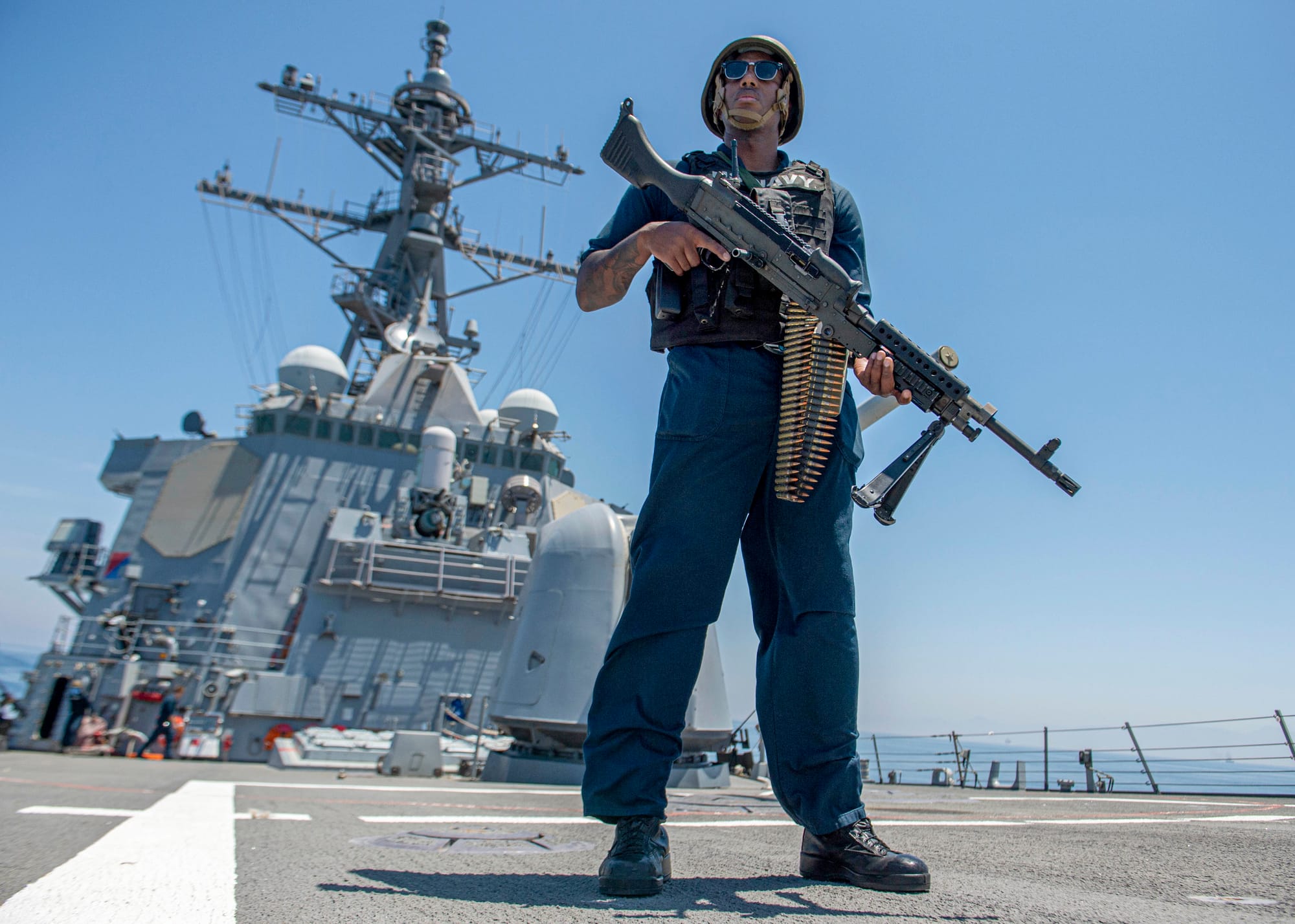 GULF OF OMAN (May 8, 2023) Master-at-Arms 1st Class Julius Earl stands watch with an M240B machine gun on the foc'scle of the guided-missile destroyer USS Paul Hamilton (DDG 60), May 8, 2023, during a Strait of Hormuz transit. Paul Hamilton is deployed to the U.S. 5th Fleet area of operations to help ensure maritime security and stability in the Middle East region. (U.S. Navy photo by Mass Communication Specialist 2nd Class Elliot Schaudt)