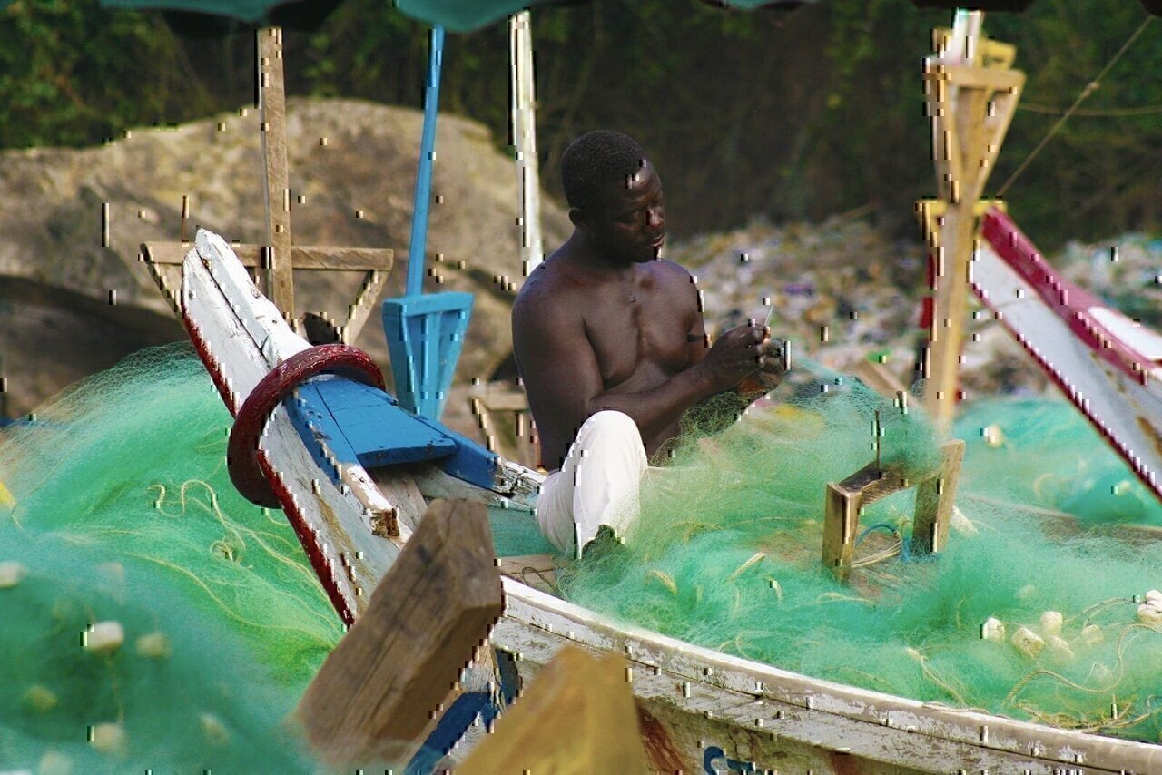 A fisherman mends his nets in Ghana's Cape Coast.
USAID’s integrated coastal fisheries governance project has assisted the Government of Ghana and key stakeholders in strengthening their capacity to conserve and protect marine fisheries. These fisheries are a critical resource in Ghana, where 60 percent of animal protein comes from marine fisheries and 2.2 million people depend on them for their livelihoods. As such, fish play an important role in Ghana’s food security. They are often the only accessible and affordable source of animal protein for poor households in urban and peri-urban areas. Fish is also smoked and dried and transported to the rural regions in the northern part of the country, where it is a critical source of protein and micro-nutrients such as iron, iodine, zinc, calcium, vitamin A and vitamin B.