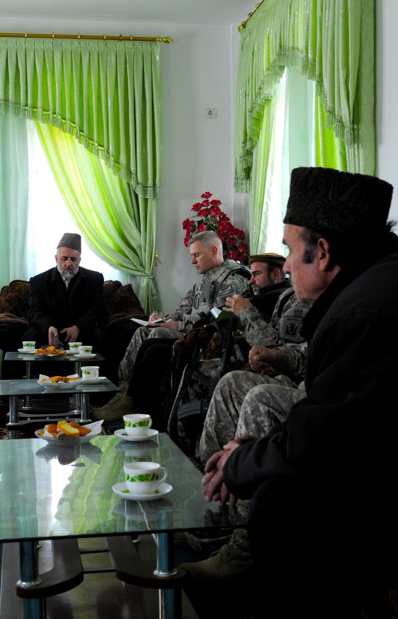 PARWAN PROVINCE, Afghanistan – U.S. Army Lt. Col. James M. Zieba, staff judge advocate for Task Force Cyclone, presented legal reference books to Abdul Basheer Yaqobi, chief prosecutor of the Parwan province, inside a newly built detention facility in Charikar city, Parwan province, Afghanistan, Feb. 16. Part of the visit was to schedule legal training for judges and prosecutors. “From the top all the way down the directive is to be cognizant of the culture and the people,” said Zieba, a Carmel, Ind. native who is deployed with the Indiana National Guard 38th Infantry Division. (Photo by U.S. Army Staff Sgt. Donald L. Reeves, Task Force Cyclone, 300th Mobile Public Affairs Detachment)