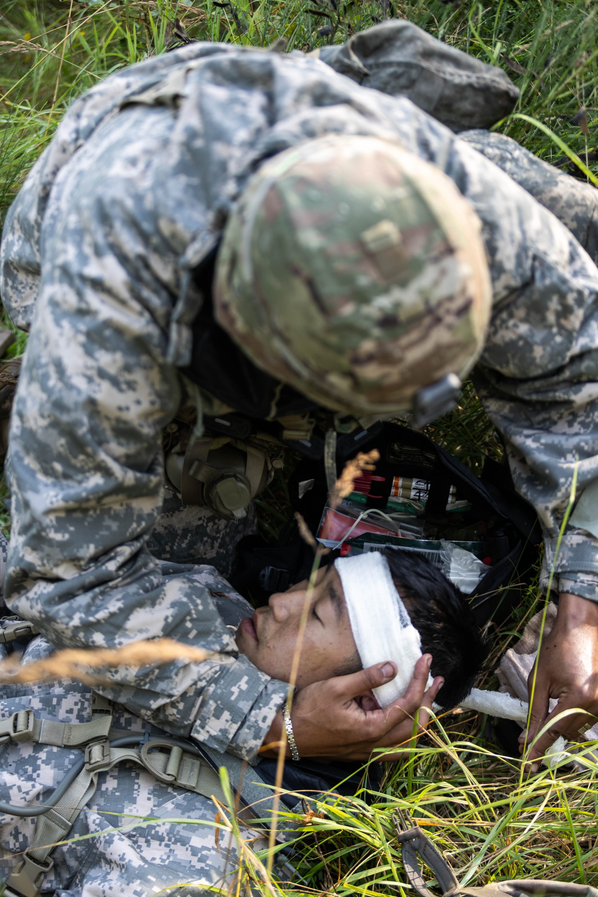 U.S. Soldiers, assigned to the 2d Theater Signal Brigade, participate in a casualty care scenario on a chemical, biological, radiological, and nuclear (CBRN) lane during the U.S. Army Europe and Africa (USAREUR-AF) Best Squad Competition at Grafenwoehr Training Area, Germany, Aug. 6, 2024. Soldiers from across USAREUR-AF will compete in the year's Best Squad Competition in Grafenwoehr, Germany, July 31 - Aug. 9, 2024. Teams representing units from across USAREUR-AF will test their tactical proficiency, communication, and overall cohesion as they compete for the title of Best Squad. Winners of this competition will advance to compete at the U.S. Army Best Squad Competition. (U.S. Army photo by Sgt. Gianna Elle Sulger)